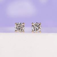 Elegant yellow gold diamond earrings for timeless style.

