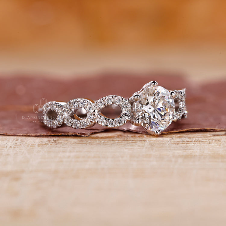 Close-up of a round cut diamond set in a 6 prong claw setting.
