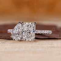 Prong setting engagement ring with a round diamond, offering a secure fit and classic design.
