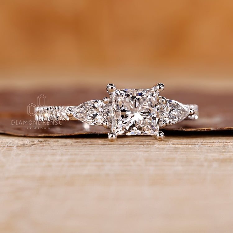 White gold ring paired with princess cut diamond ring in handmade ring design.
