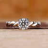 Round diamond engagement ring with double claw prong setting
