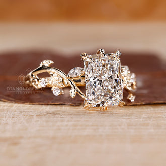 Six leaf style prong setting radiant diamond ring in yellow gold band
