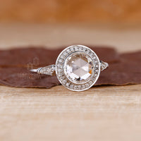 Lab grown diamond in a white gold bezel setting ring.
