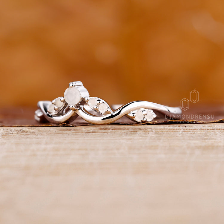 Cluster moonstone wedding band in white gold.
