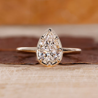 Pear cut diamond engagement ring with solitaire setting handmade.
