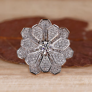 Cluster engagement ring featuring round diamonds in white gold setting.
