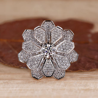 Cluster engagement ring featuring round diamonds in white gold setting.
