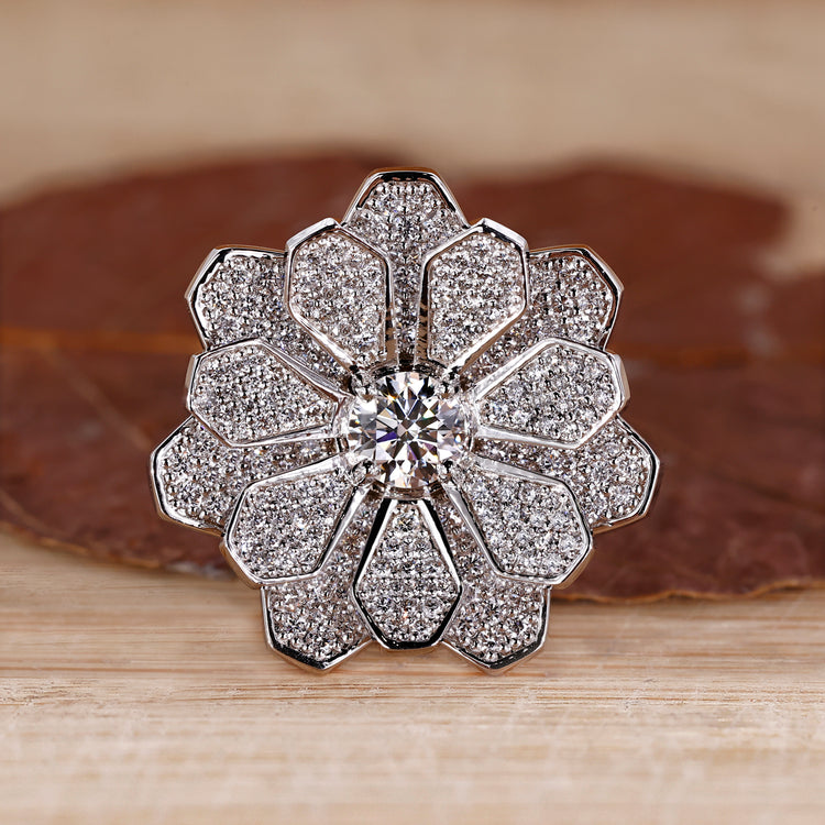 Cluster engagement ring featuring round diamonds in white gold setting.
