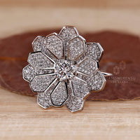 Nature inspired engagement ring with cluster of diamonds in white gold.
