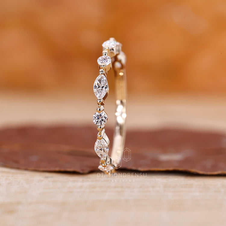 Prong set wedding band showcasing lab grown diamonds.
