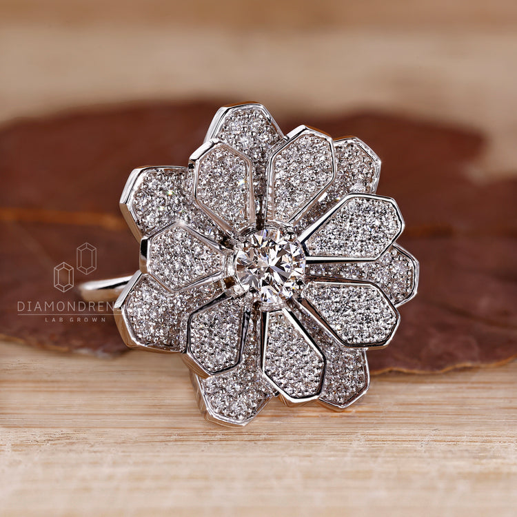 White gold ring with cluster diamond engagement design and four prong setting.
