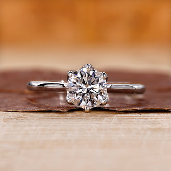 This is a round diamond engagement ring.
