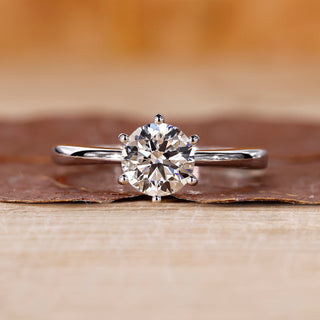 Round diamond engagement ring crafted with a six prong setting, offering stability and secure handmade quality.
