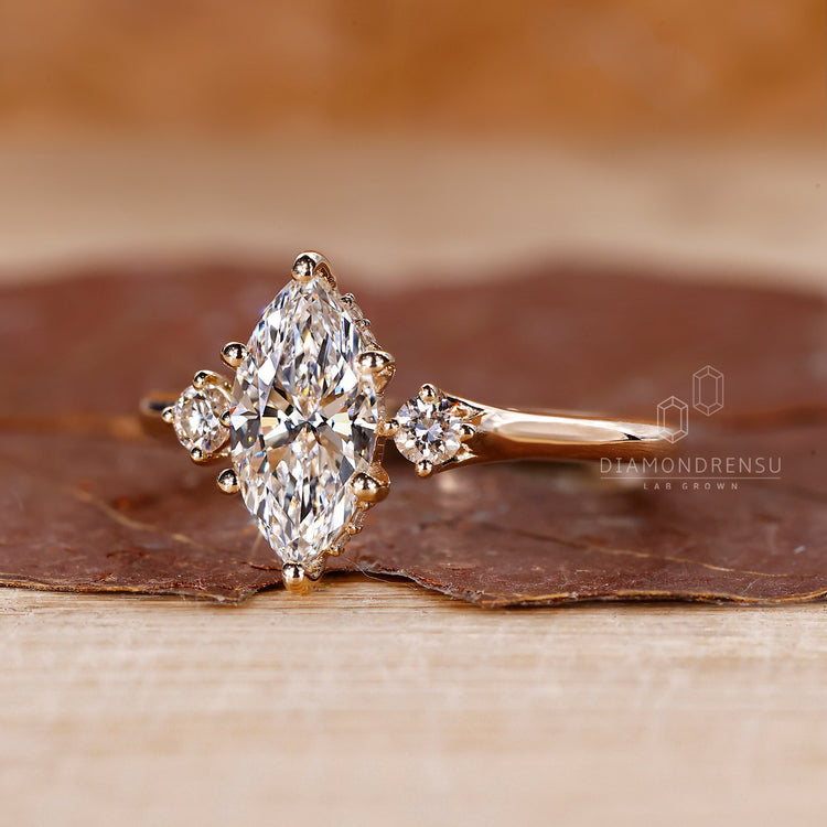 Marquise diamond ring in a yellow gold band, handmade for those who appreciate a unique, vintage-inspired design.
