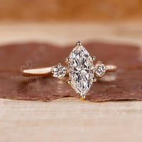 Marquise and 2 round side diamond ring featuring clean lines and a sleek, secure prong setting for everyday wear.
