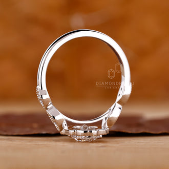Diamondrensu engagement ring with marquise outline.