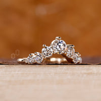 Curved wedding band handcrafted with precision and care.
