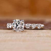 Handmade ring with seven round cut stones in white gold.
