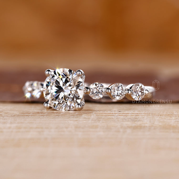 Handmade ring with seven round cut stones in white gold.
