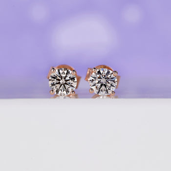 1 carat diamond stud earrings with an elegant diamond prong setting.
