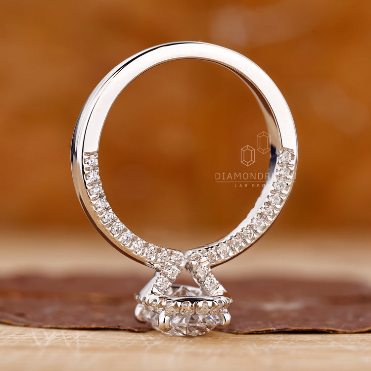 Diamondrensu Engagement Ring with IGI certified oval cut diamond in a halo setting.

