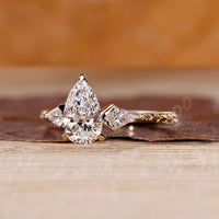 Pear cut engagement ring with tapered shank and 3 claw prong setting.
