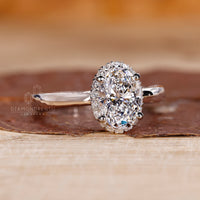 White Gold Ring with Halo Setting Diamond Ring for added brilliance.
