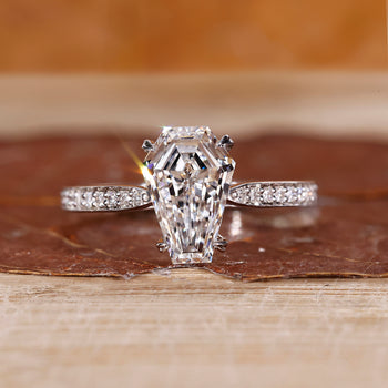 Coffin cut engagement ring in white gold with unique shape.
