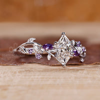 Twisted shank nature inspired ring with tanzanite round side gemstone.
