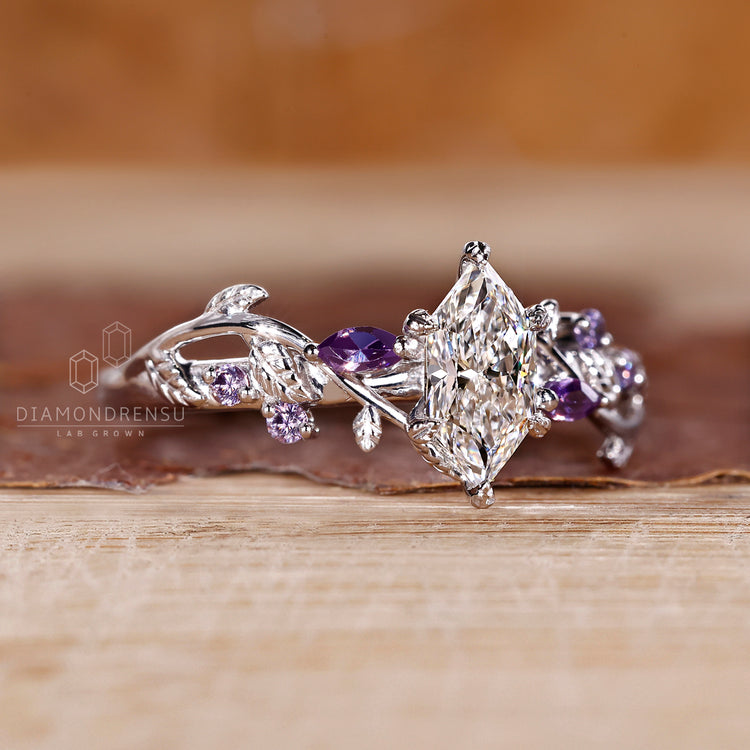 Twisted shank nature inspired ring with tanzanite round side gemstone.
