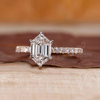 Yellow and white gold ring with hexagon step cut diamond.
