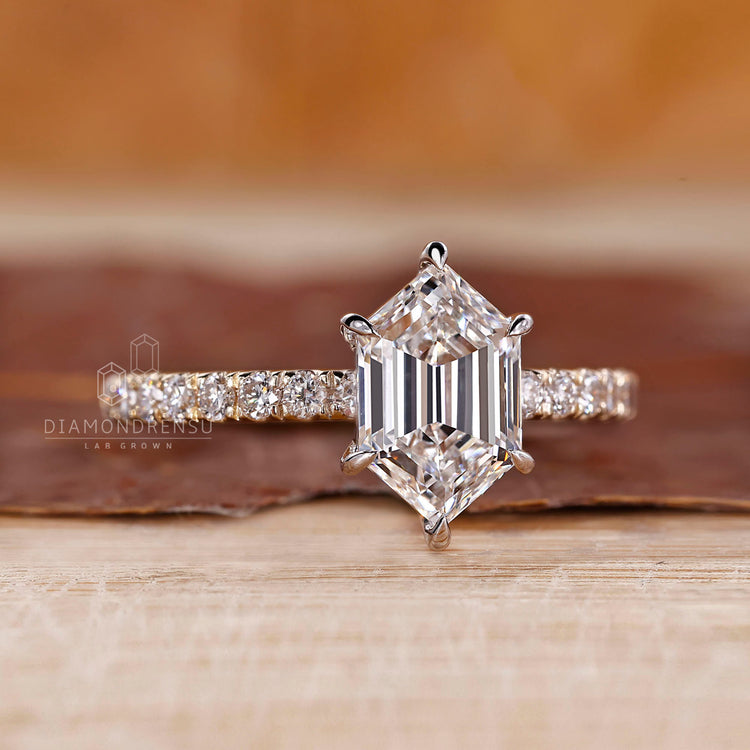 Round cut pave band ring featuring hexagon step cut diamond.
