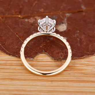Custom diamond ring with hexagon step cut diamond and pave setting.
