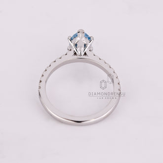 Buy engagement ring with marquise cut blue diamond and cathedral setting.
