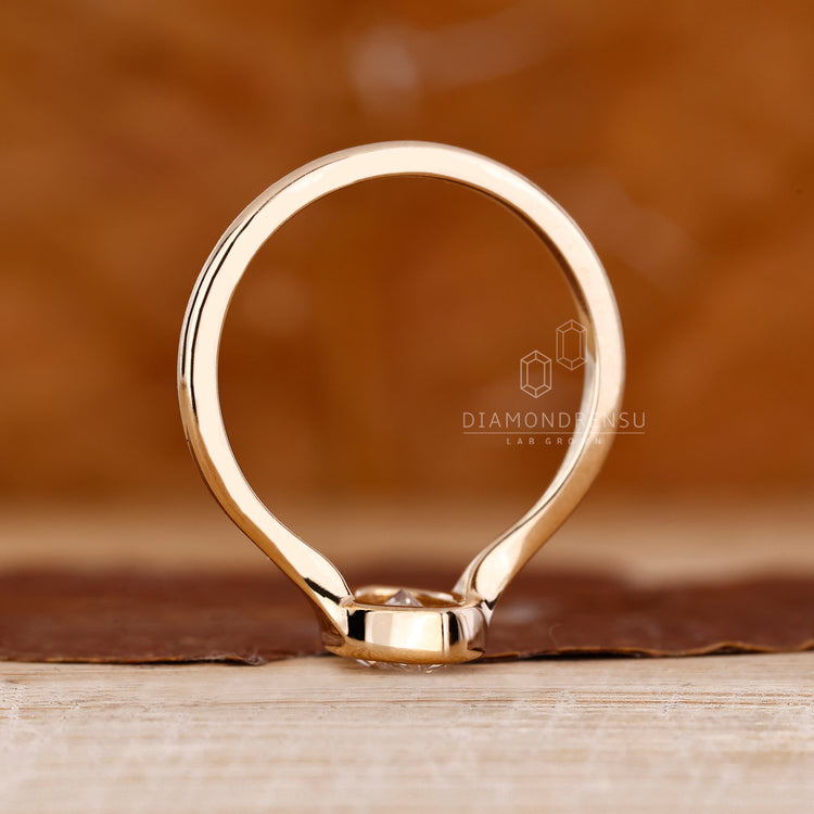 Bezel setting ring designed for yellow gold engagement ring.

