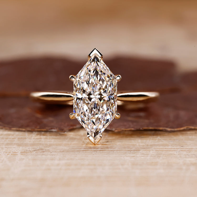 Cathedral Setting Ring with Dutch marquise diamond in yellow gold.
