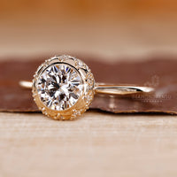 Bezel Set Engagement Ring with a round cut diamond and a tapered shank.
