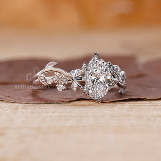 Unique engagement ring with floral vine-inspired styling.
