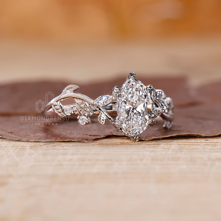 Unique engagement ring with floral vine-inspired styling.
