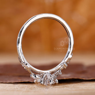 Lab grown diamond featured in an artistic vine ring.
