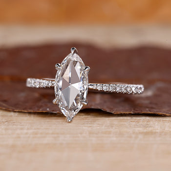 Marquise rose cut ring with a tapered shank design.

