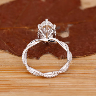 Proposal ring with marquise center and round halo.

