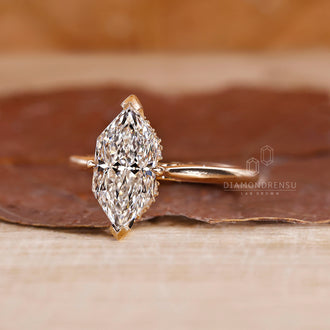 Yellow Gold Engagement Ring with a Dutch Marquise diamond and custom design options.
