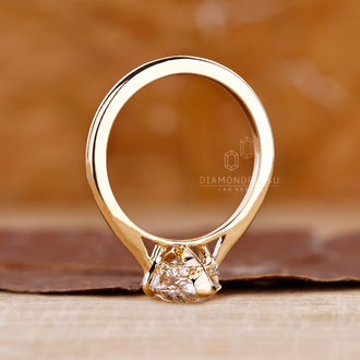 Buy Engagement Ring with a Dutch Marquise cut and hidden halo in a yellow gold setting.
