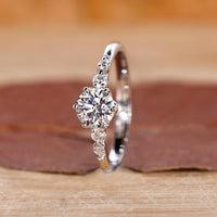 5 diamond ring with tapered shank band and white gold engagement ring featuring 6 round prong setting.
