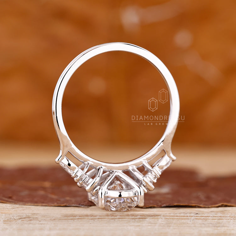 Lab Grown Diamond white gold engagement ring with cluster side stones.
