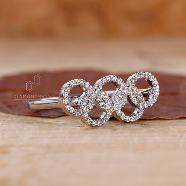 Unique engagement ring inspired by Olympic ring design.
