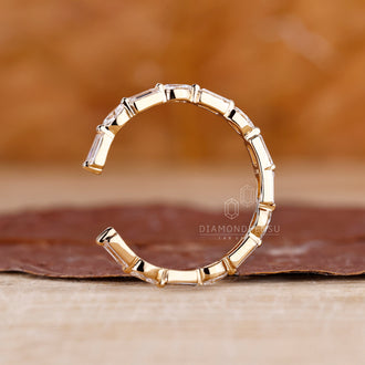 Yellow gold wedding band with sparkling baguette cuts.
