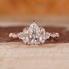 Pear cut engagement ring with muse setting in rose gold.
