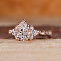 Marquise shape pave engagement ring with pear cut centre.
